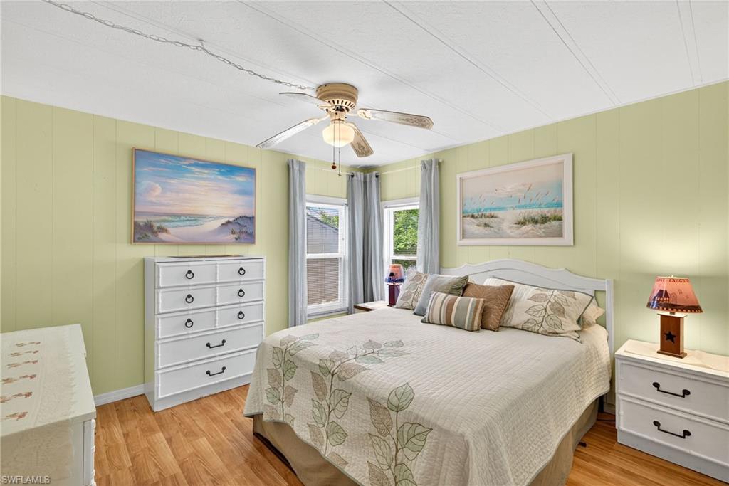 170 Oceans Boulevard, Unit 170 Naples, FL 34104 - Photo 17 of 36 a bedroom with a bed and a dresser