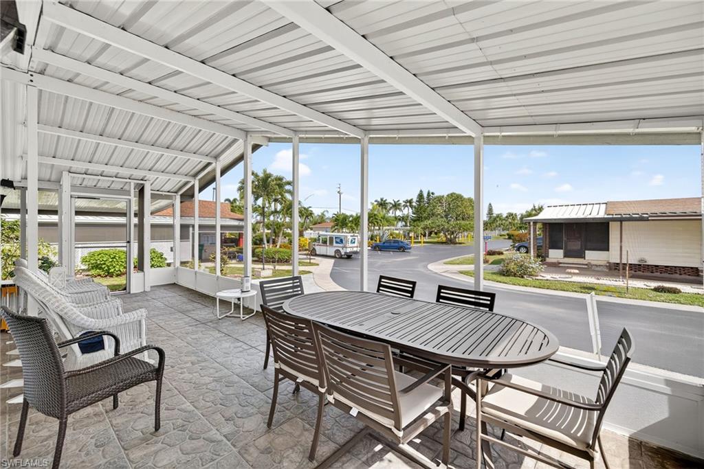170 Oceans Boulevard, Unit 170 Naples, FL 34104 - Photo 20 of 36 a view of a dining room with furniture window and outside view