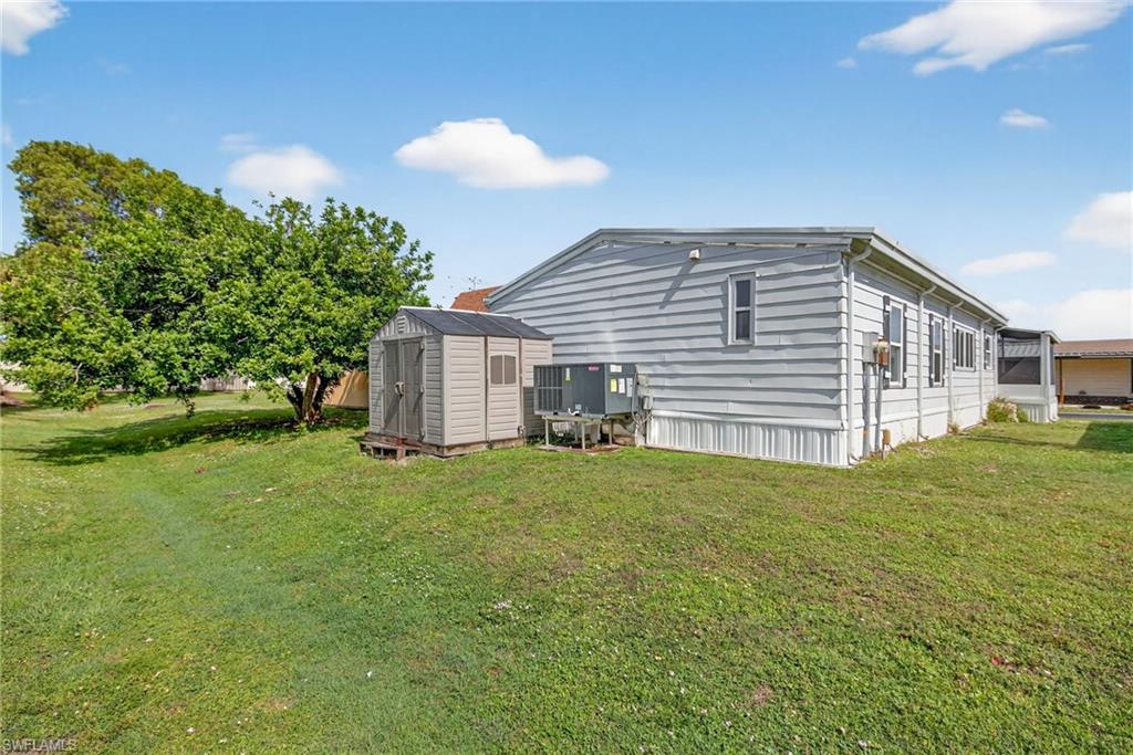 170 Oceans Boulevard, Unit 170 Naples, FL 34104 - Photo 23 of 36 a view of a backyard of the house