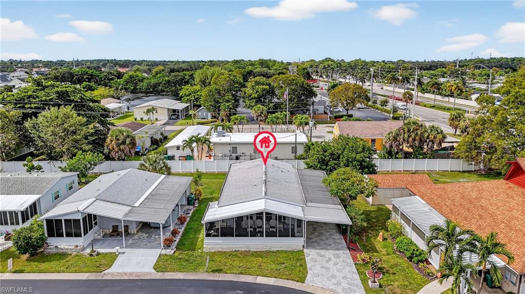 170 Oceans Boulevard, Unit 170 Naples, FL 34104 - Photo 24 of 36 a aerial view of a house with a yard
