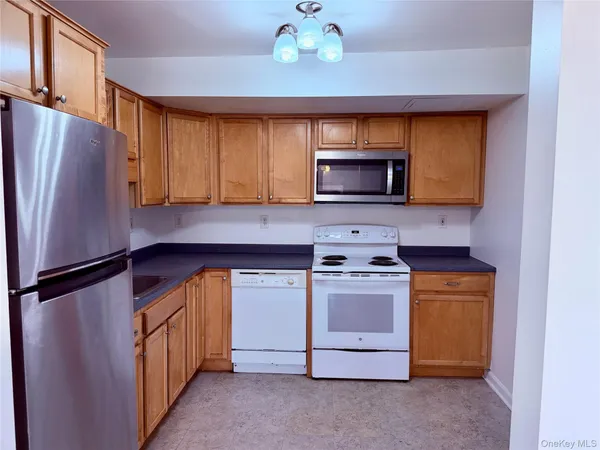 a kitchen with a stove microwave and refrigerator