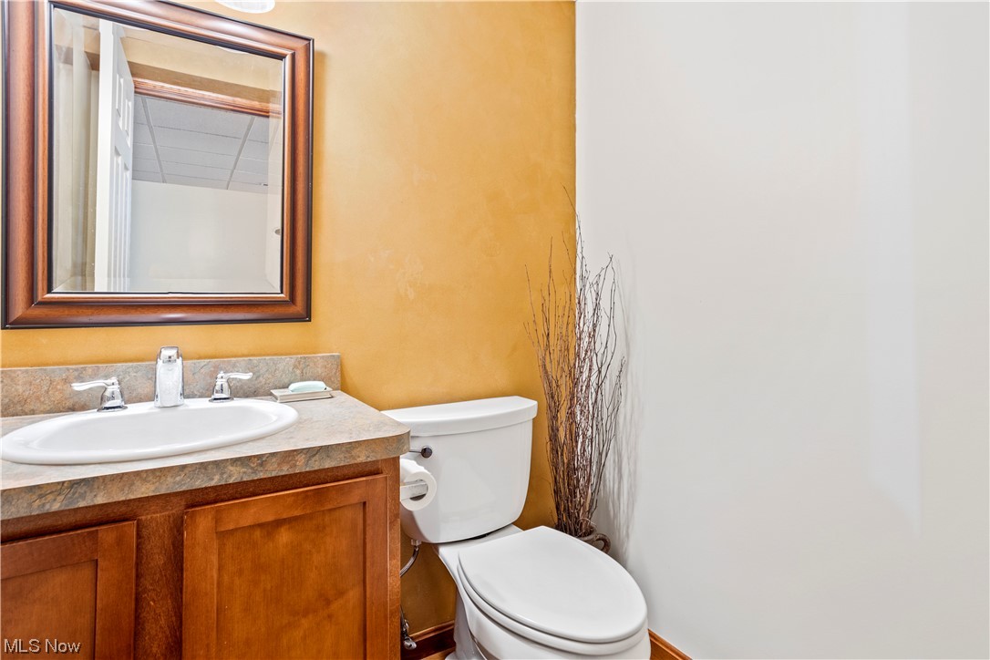 9240 Murray Ridge Road Elyria, OH 44035 - Photo 29 of 34 Bathroom with vanity with extensive cabinet space and mirror 1/2 bath in basement