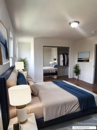 a bedroom with a bed window and couch