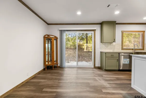a view of a kitchen with a sink and a window