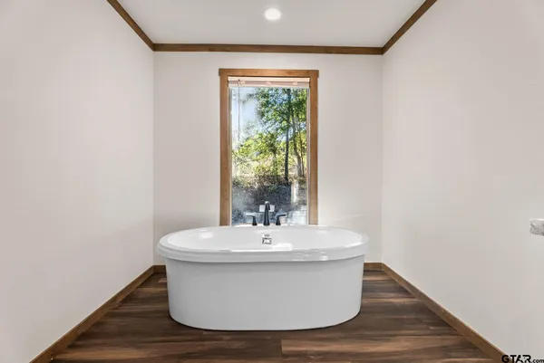 a white bath tub sitting in a bathroom