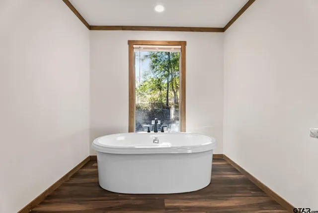 a white bath tub sitting in a bathroom