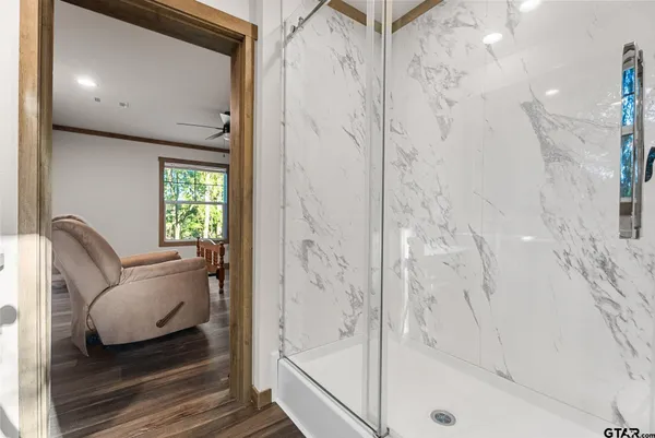 a bathroom with a bathtub and shower