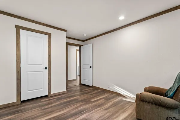 a view of a livingroom with wooden floor