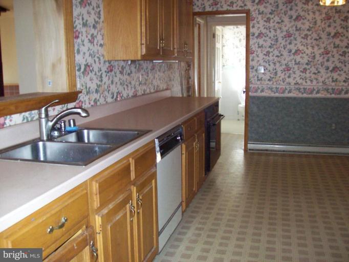 5025 Old Quarter Road Upperco, MD 21155 - Photo 14 of 18 a kitchen with a sink and cabinets