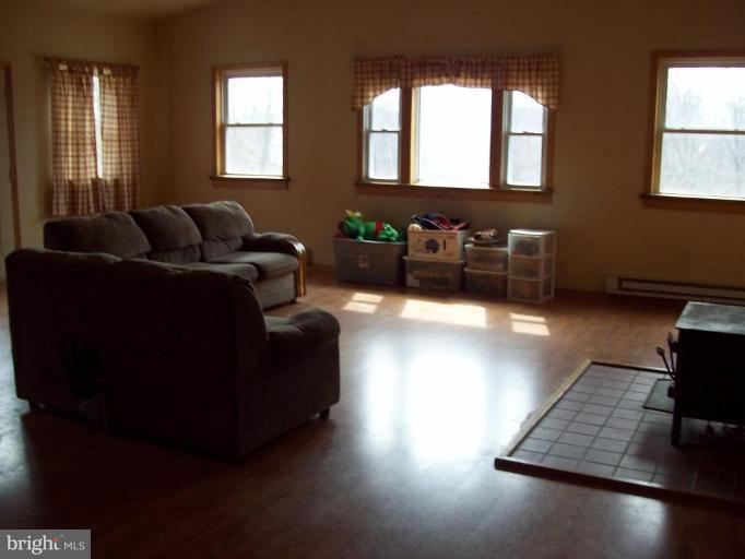 5025 Old Quarter Road Upperco, MD 21155 - Photo 6 of 18 a living room with furniture window and wooden floor