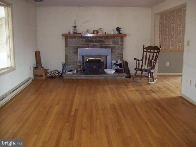 5025 Old Quarter Road Upperco, MD 21155 - Photo 9 of 18 a living room with furniture and a fireplace