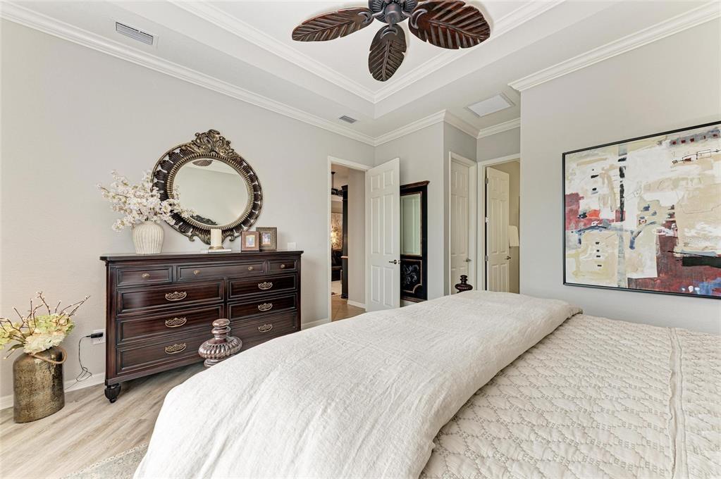 13117 Ramblewood Trail Lakewood Ranch, FL 34211 - Photo 33 of 76 a bedroom with a bed and a dresser