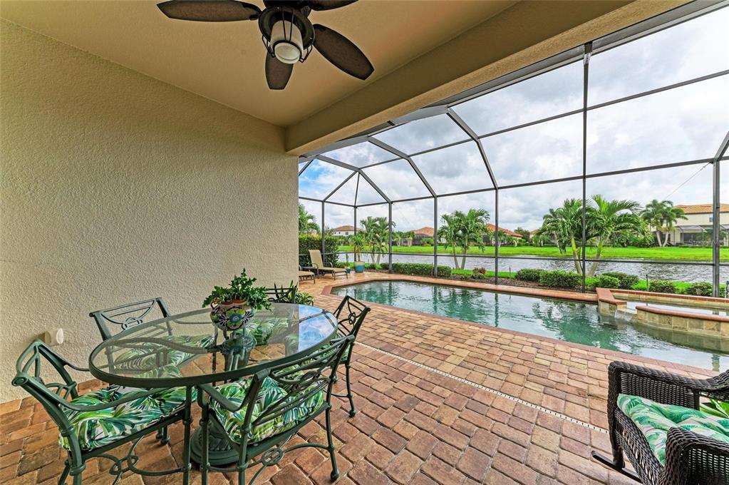 13117 Ramblewood Trail Lakewood Ranch, FL 34211 - Photo 48 of 76 a view of house with swimming pool and sitting area