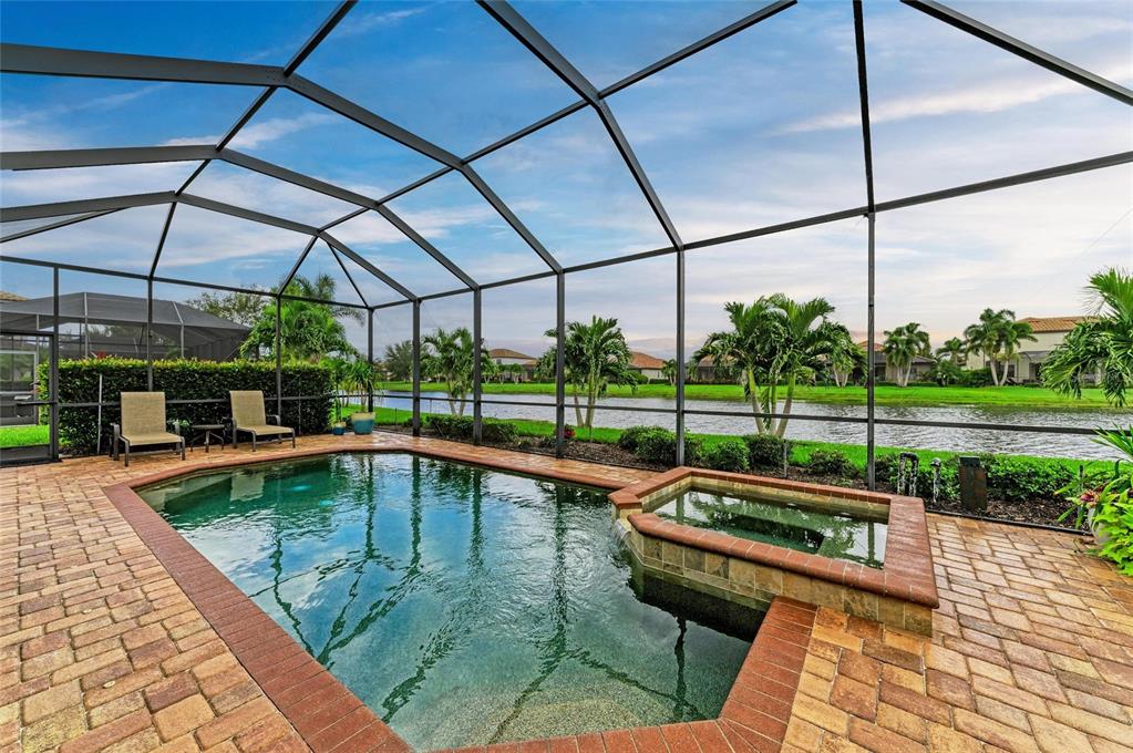 13117 Ramblewood Trail Lakewood Ranch, FL 34211 - Photo 51 of 76 a view of a swimming pool with a patio