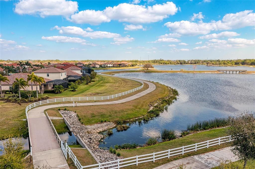 13117 Ramblewood Trail Lakewood Ranch, FL 34211 - Photo 75 of 76 a view of a swimming pool with a yard and mountain view