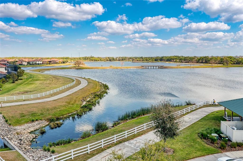 13117 Ramblewood Trail Lakewood Ranch, FL 34211 - Photo 76 of 76 a view of a lake with a yard