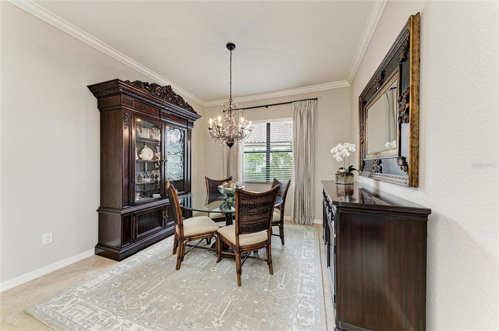 13117 Ramblewood Trail Lakewood Ranch, FL 34211 - Photo 9 of 76 a dining room with furniture and window