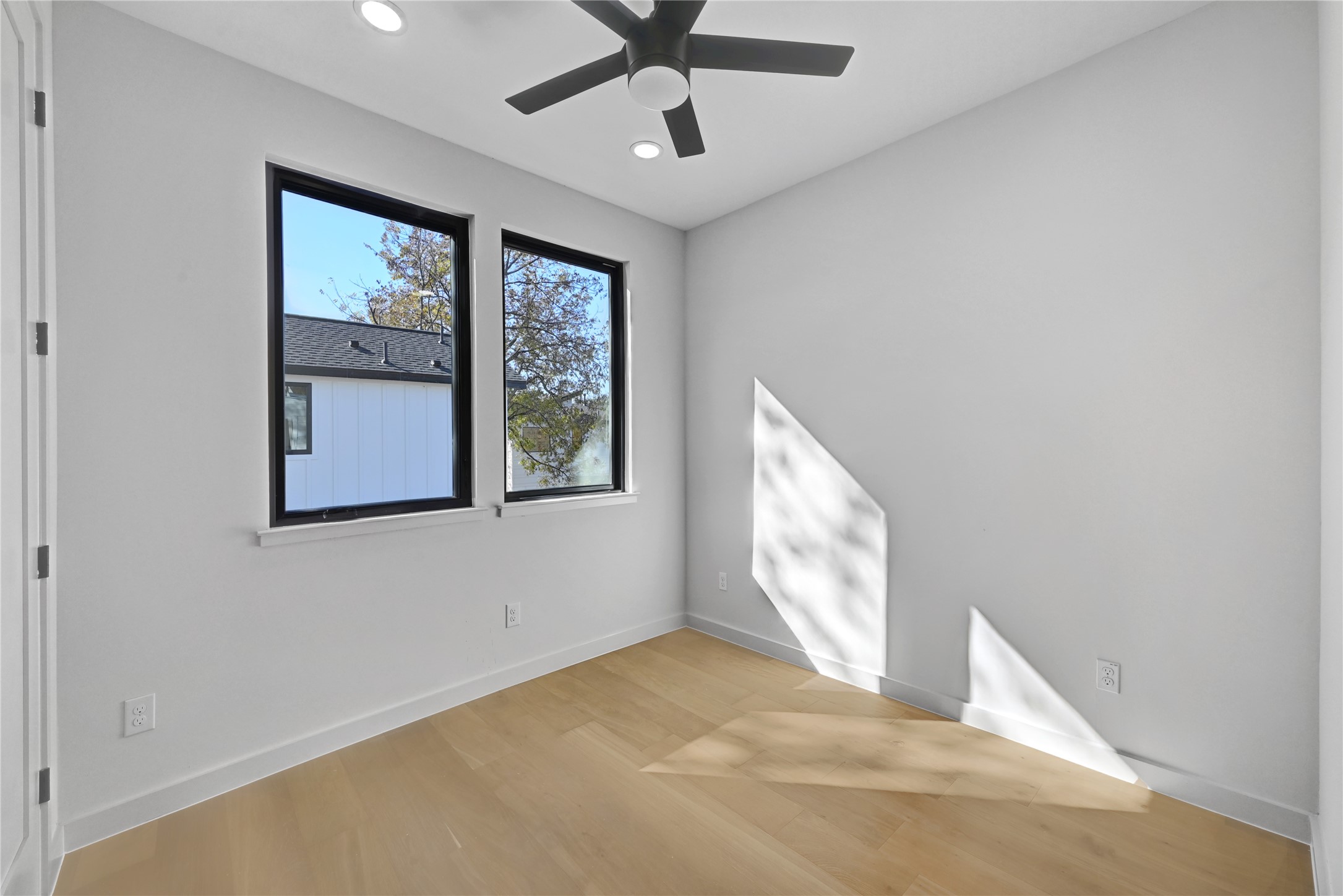 2717 Lyons Road, Unit 1 Austin, TX 78702 - Photo 23 of 34 Empty room featuring wood finished floors, recessed lighting, and a ceiling fan