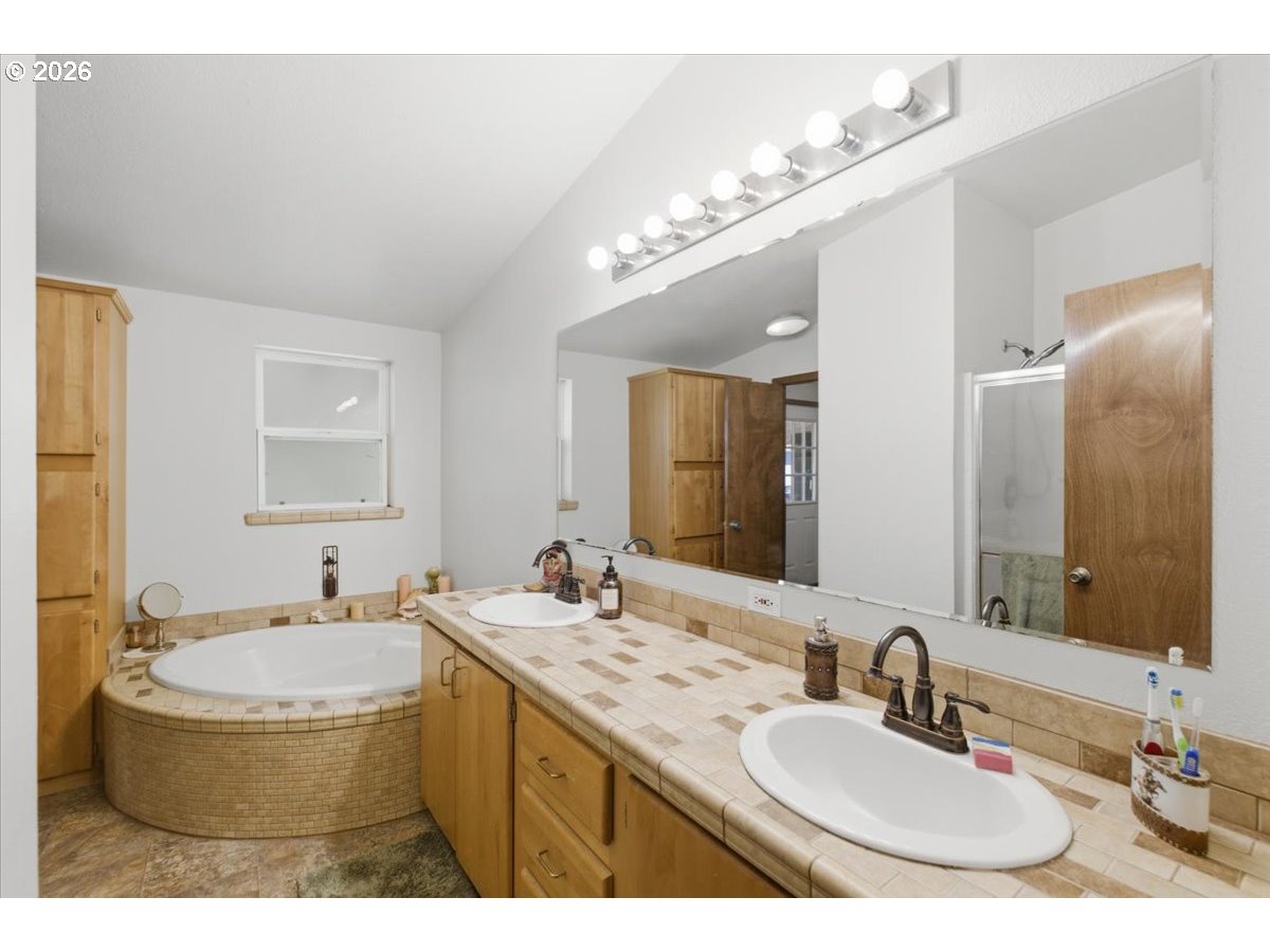 35377 Ede Road Lebanon, OR 97355 - Photo 20 of 48 a bathroom with a granite countertop sink and a mirror