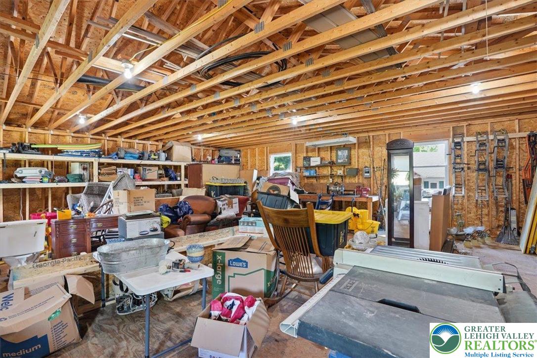 4880 Little Gap Road Kunkletown, PA 18058 - Photo 53 of 100 This spacious garage offers exposed wood beams and abundant storage space, ready for your customization.