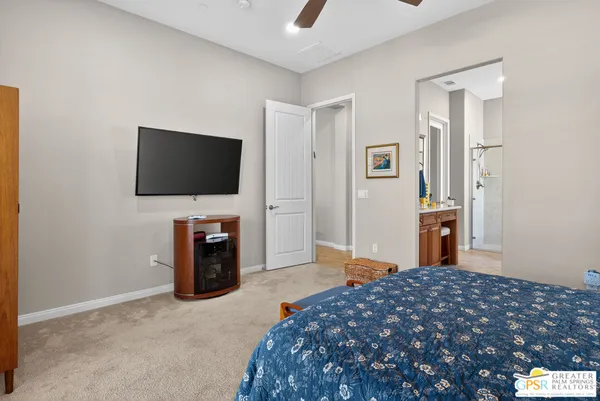 a bedroom with a bed and a mirror