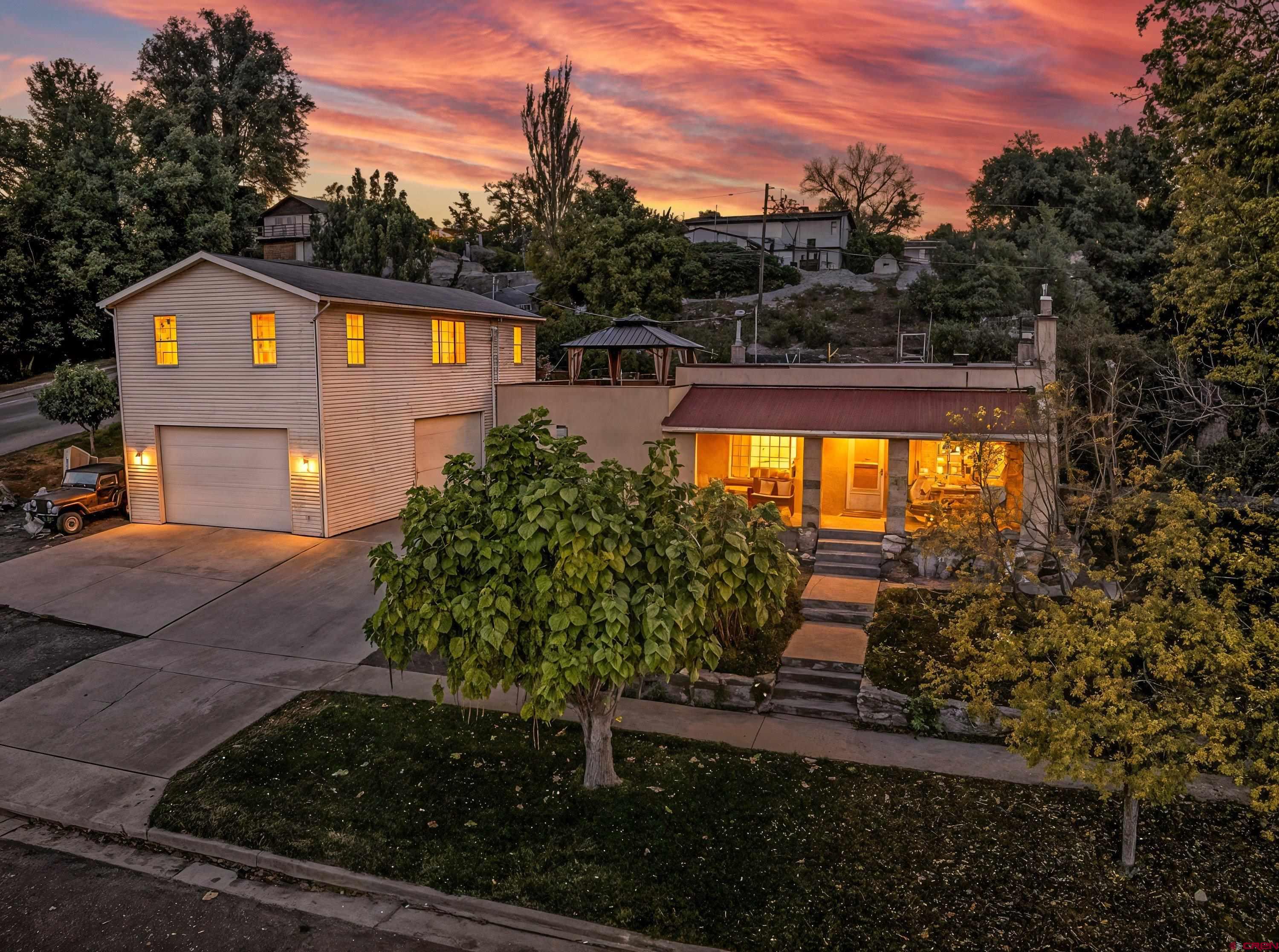 6-lot estate! Adorable bungalow + separate bldg w/ 1100sf shop & 1100sf luxury apartment above. Zoned Residential/Commercial. Granite kitchen, wood floors, lush gardens & fruit trees. Rooftop deck w/ Mesa views & hot tub. Meticulous care & versatility!