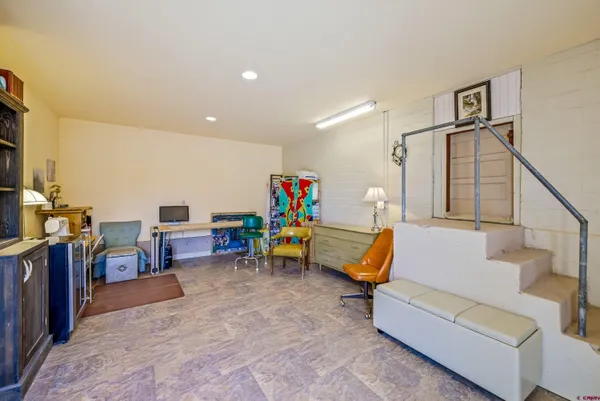 a view of a storage & utility room with stairs