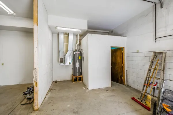 a view of a patio with chairs and a yard