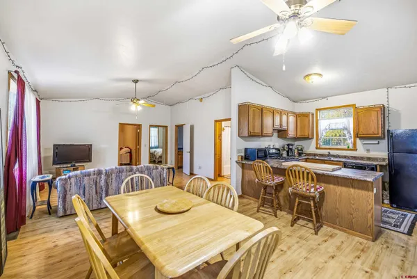 a view of a chairs and table in backyard