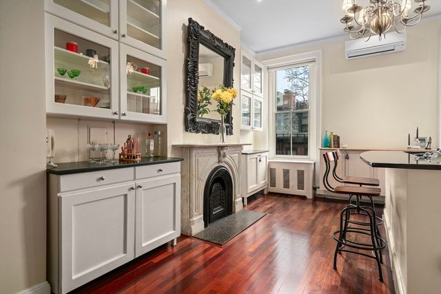 a view of a bedroom with furniture and a fireplace