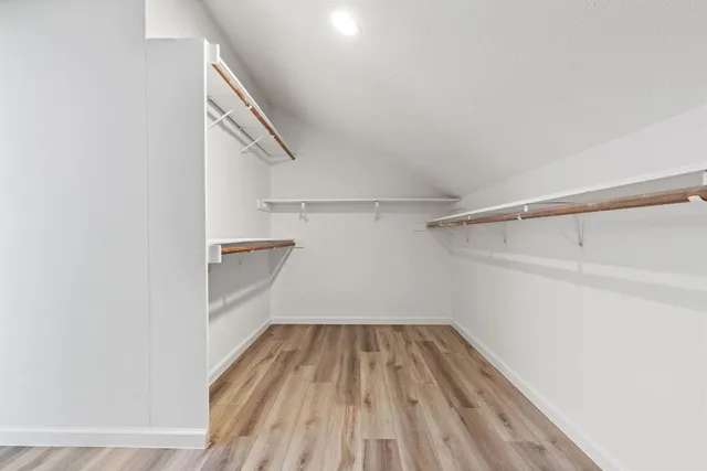 a view of a room with wooden floors and floors
