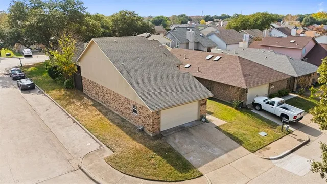 an aerial view of a house with swimming pool
