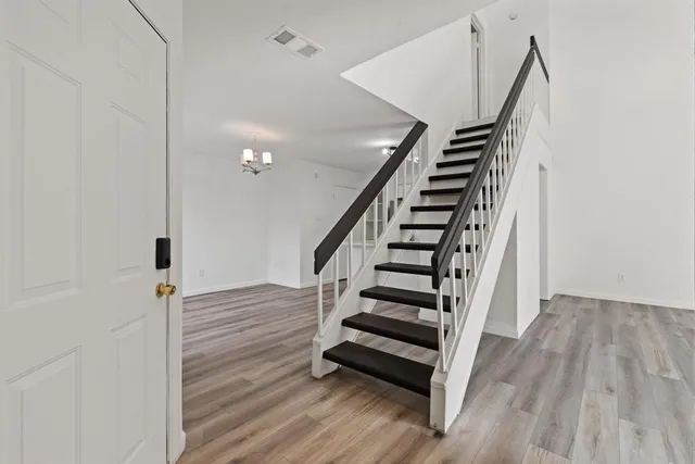 a view of entryway with wooden floor