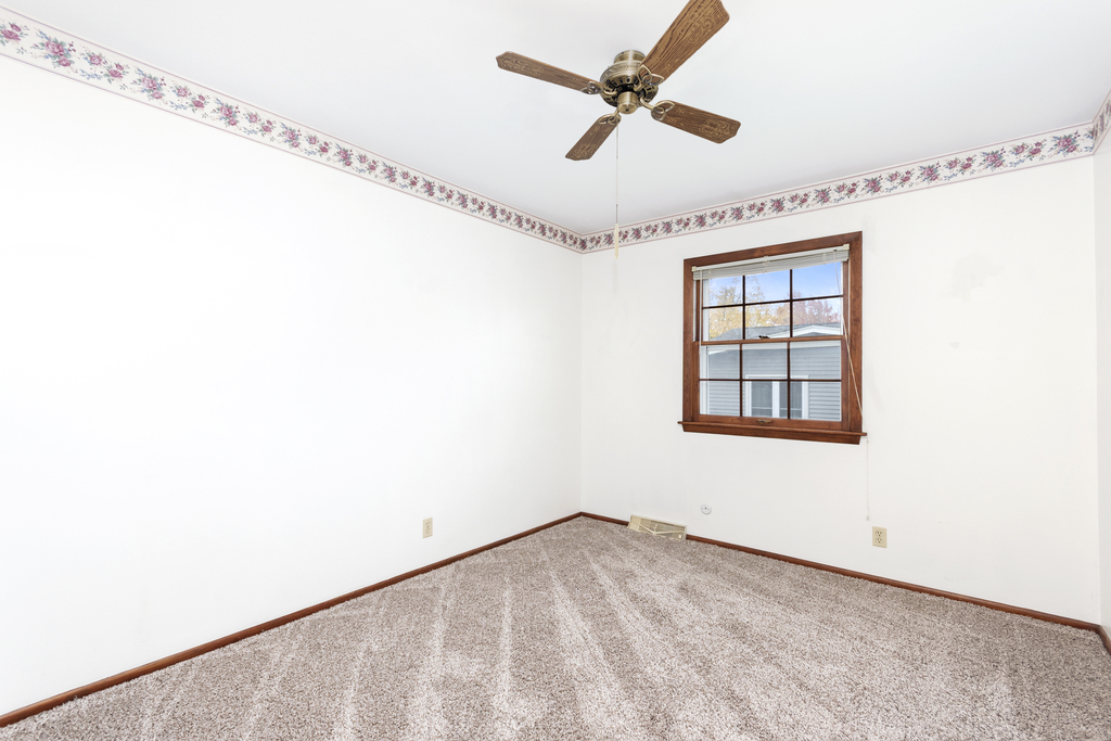11 Woodcliff Road Montgomery, IL 60538 - Photo 11 of 18 a view of an empty room with a window
