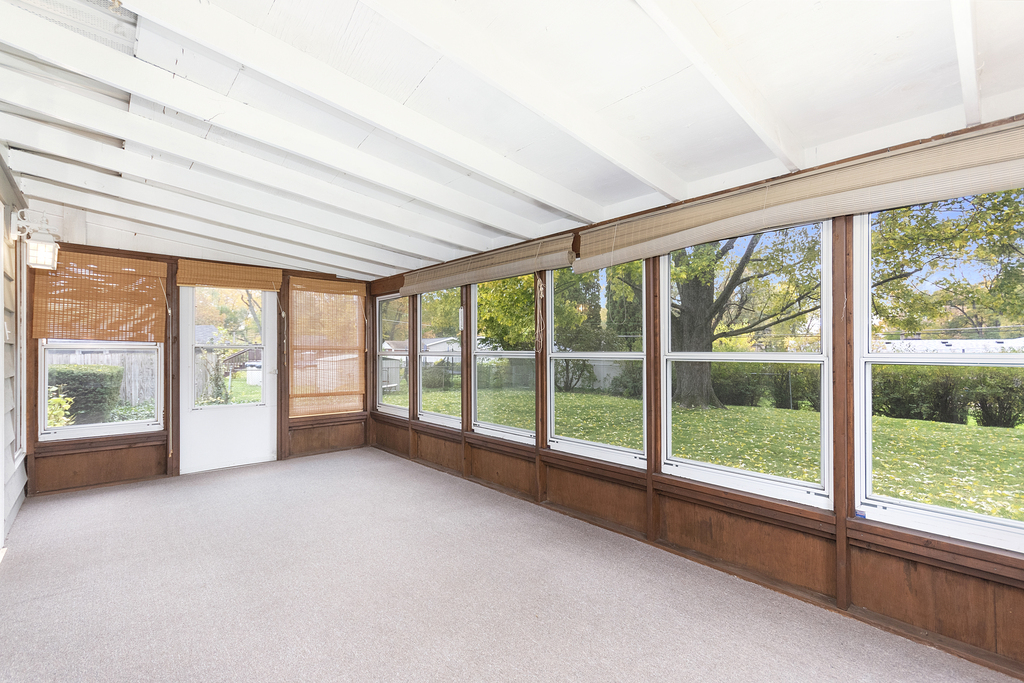 11 Woodcliff Road Montgomery, IL 60538 - Photo 12 of 18 a view of an empty room with windows and city view
