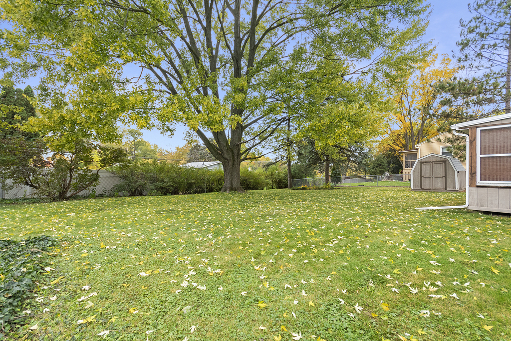 11 Woodcliff Road Montgomery, IL 60538 - Photo 15 of 18 a view of outdoor space with deck and trees
