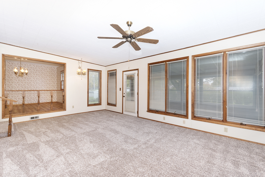11 Woodcliff Road Montgomery, IL 60538 - Photo 4 of 18 a view of an empty room with a window