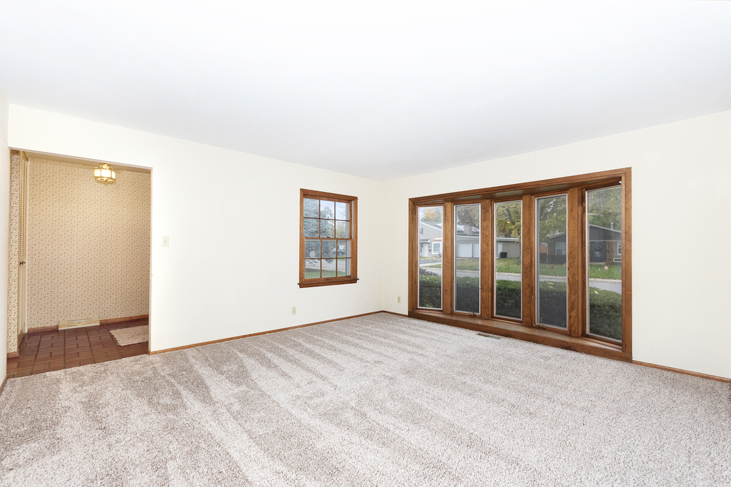 11 Woodcliff Road Montgomery, IL 60538 - Photo 5 of 18 an empty room with windows