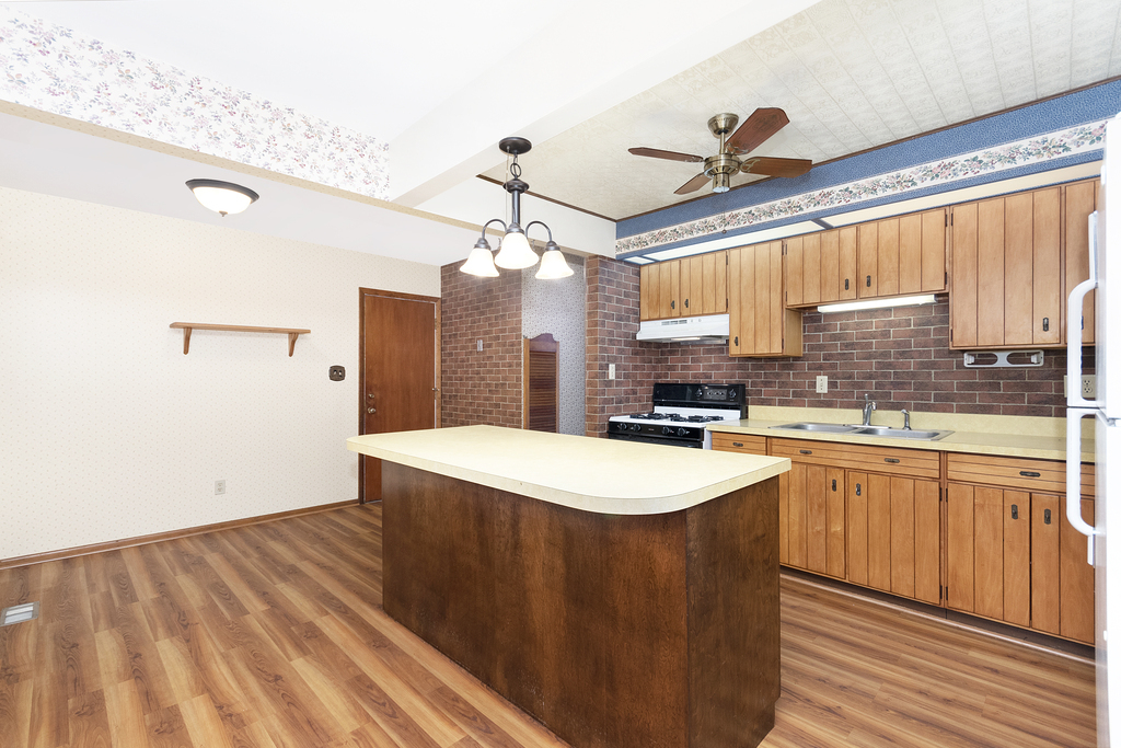 11 Woodcliff Road Montgomery, IL 60538 - Photo 6 of 18 a kitchen with a sink a refrigerator and window