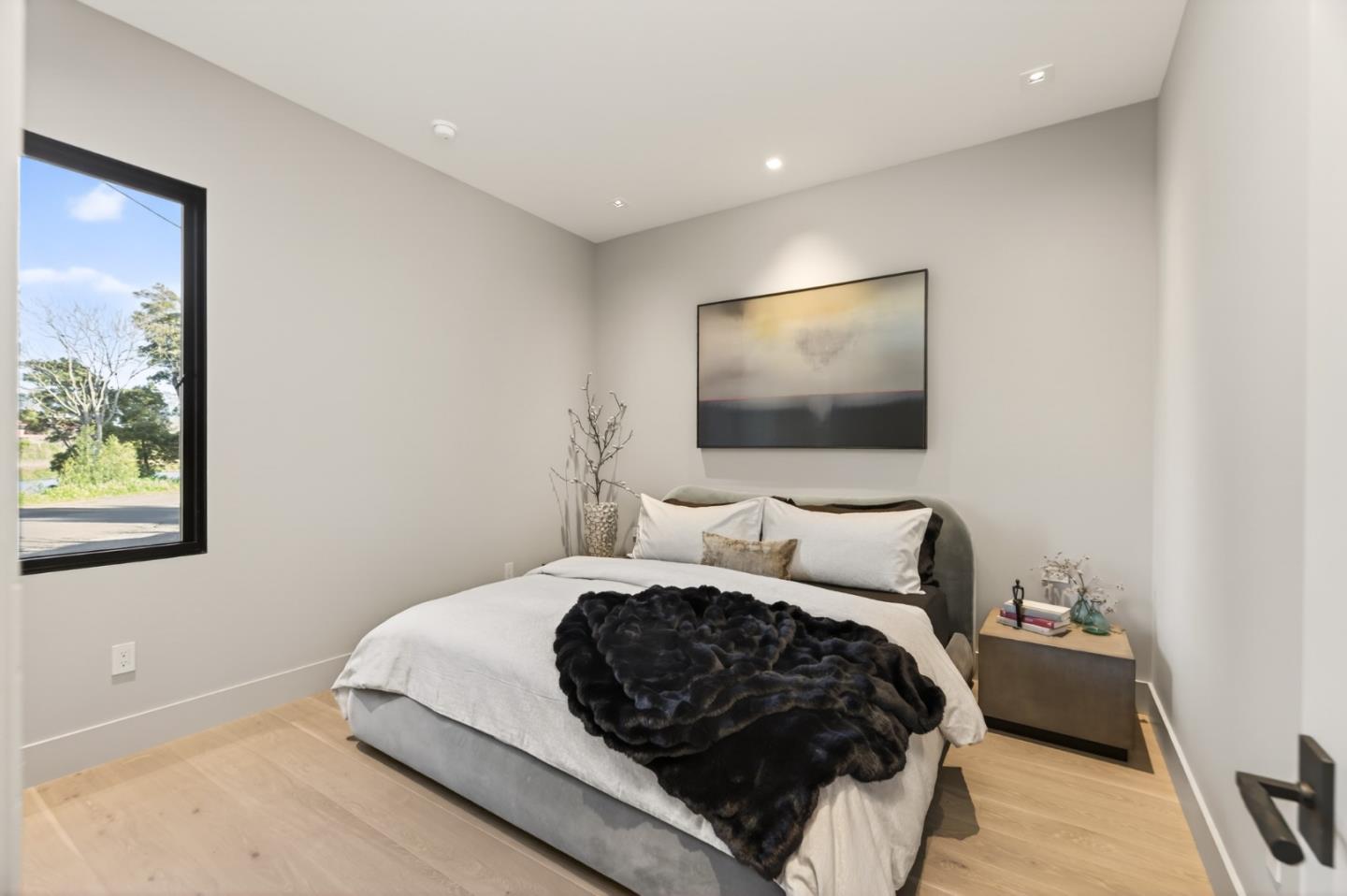 585 Riverside Drive Napa, CA 94559 - Photo 21 of 36 a bedroom with a bed and a flat screen tv