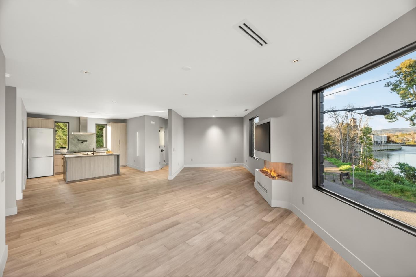 585 Riverside Drive Napa, CA 94559 - Photo 27 of 36 a view of a living room and a kitchen with wooden floor