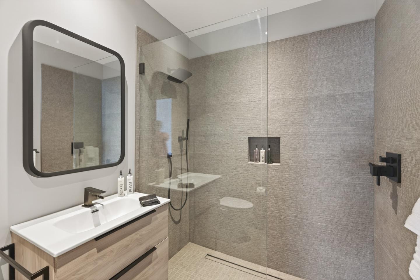 585 Riverside Drive Napa, CA 94559 - Photo 31 of 36 a bathroom with a sink vanity granite toilet and a mirror