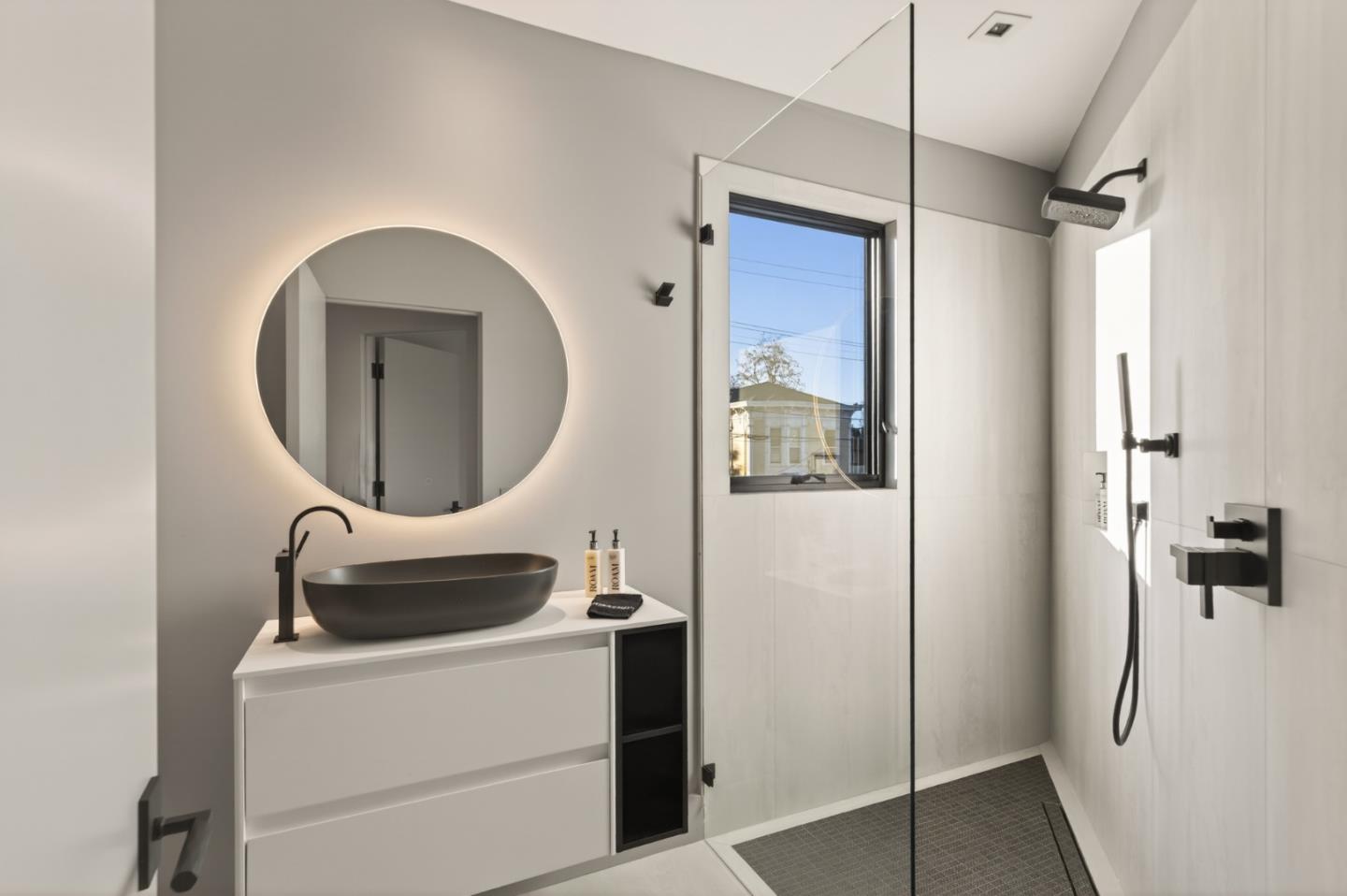 585 Riverside Drive Napa, CA 94559 - Photo 34 of 36 a bathroom with a sink a mirror and shower