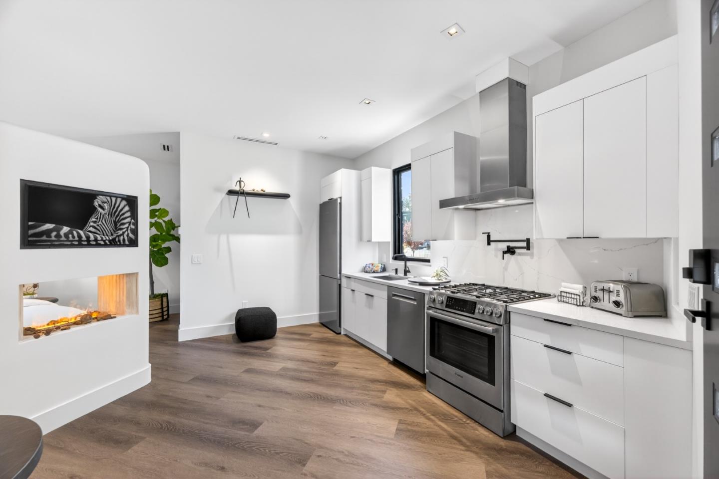 585 Riverside Drive Napa, CA 94559 - Photo 7 of 36 a kitchen with stainless steel appliances a stove a sink and a refrigerator