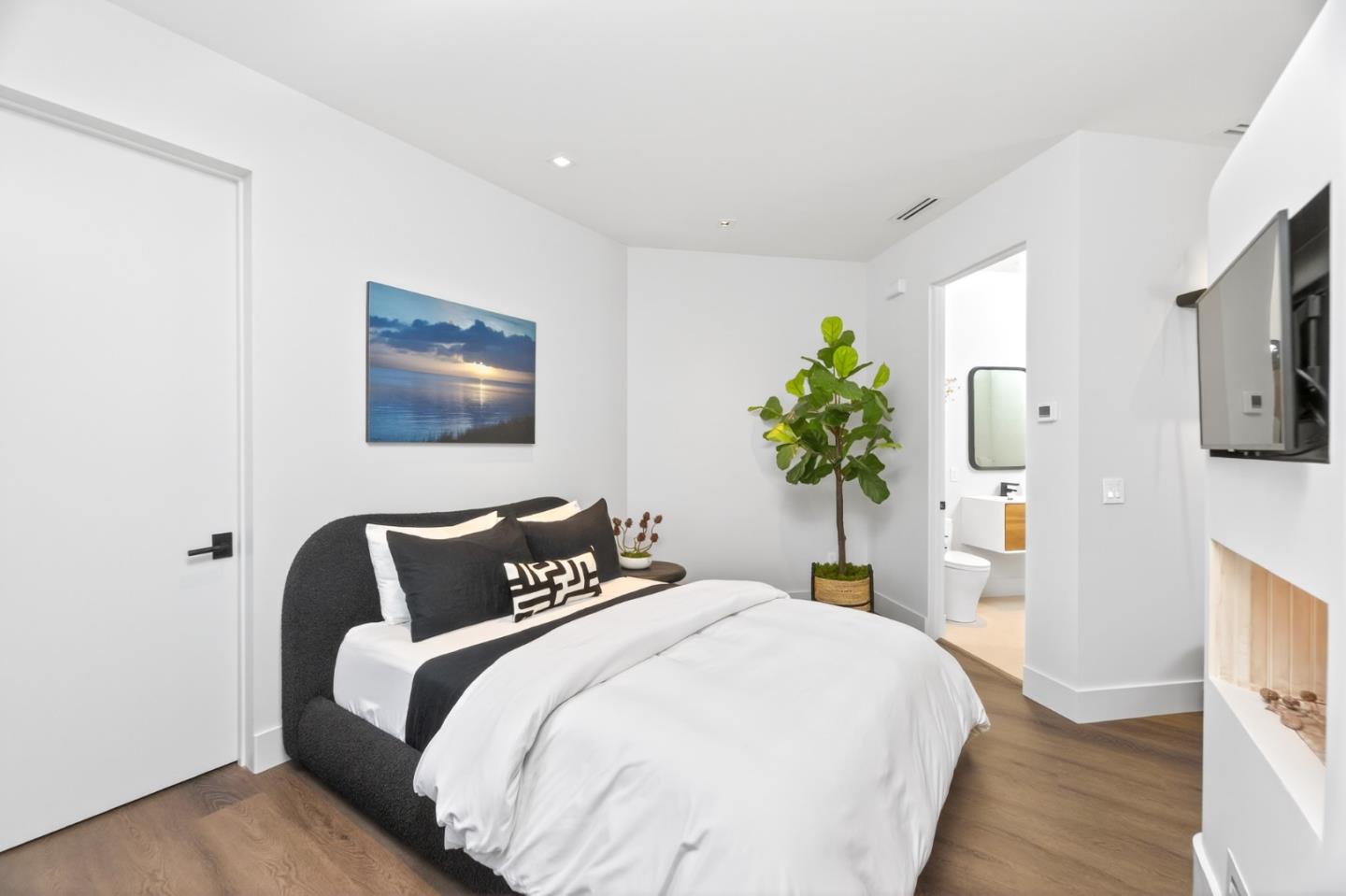 585 Riverside Drive Napa, CA 94559 - Photo 10 of 36 a bedroom with bed and a potted plant