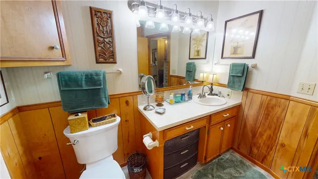 a kitchen with a sink a stove and cabinets