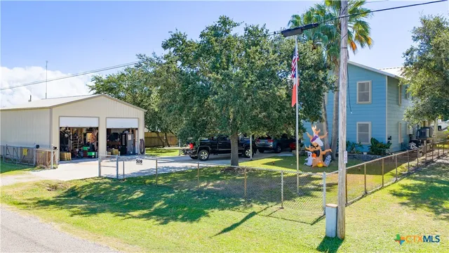 a view of a house with swimming pool and sitting area
