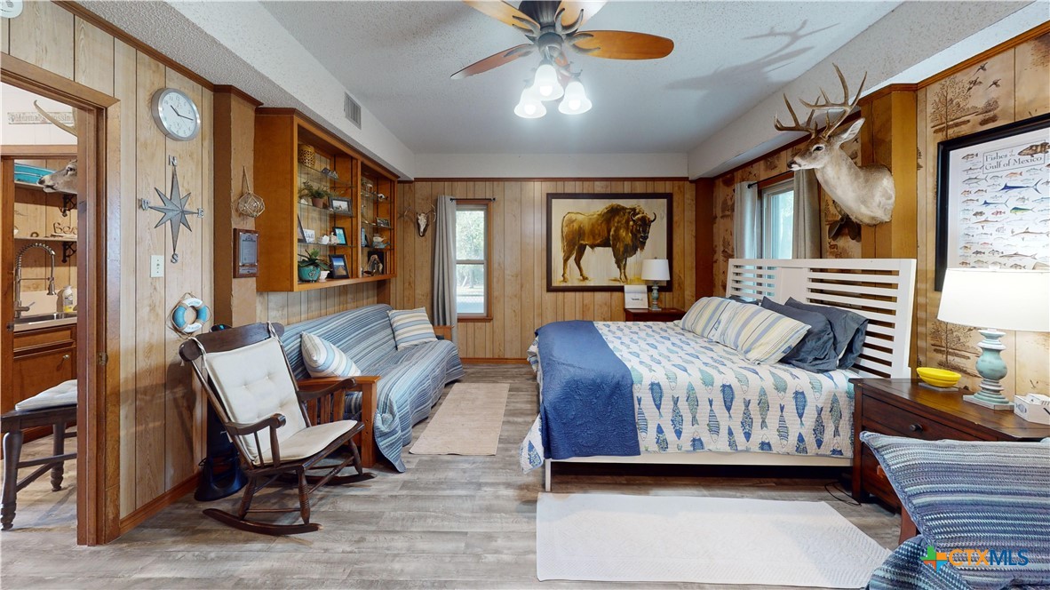 509 Monroe Avenue Port O'Connor, TX 77982 - Photo 38 of 46 a bedroom with furniture and a large window