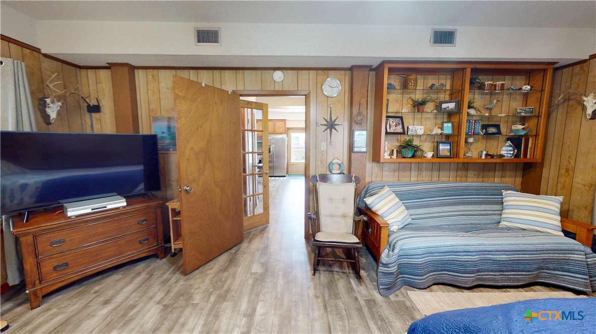 509 Monroe Avenue Port O'Connor, TX 77982 - Photo 41 of 46 a view of walk in closet with wooden floor