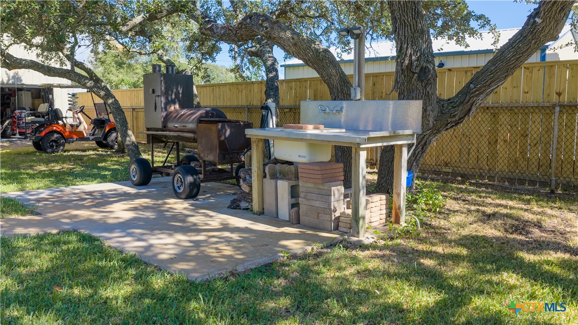 509 Monroe Avenue Port O'Connor, TX 77982 - Photo 6 of 46 a view of a house with a yard